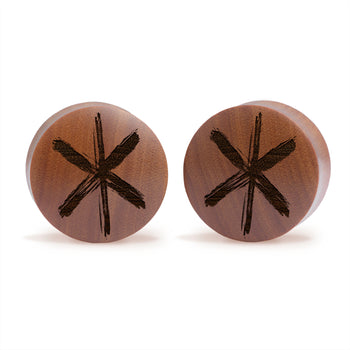 Woman wearing awesome demon face acrylic inlay and wood plugs / gauges