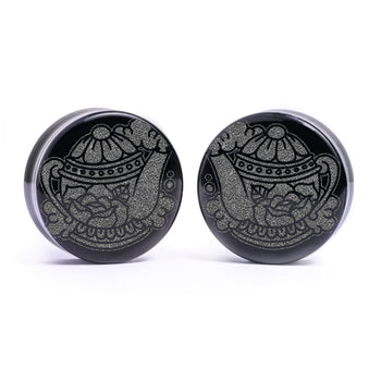 Man wearing awesome salem cat skull acrylic inlay and wood plugs & gauges